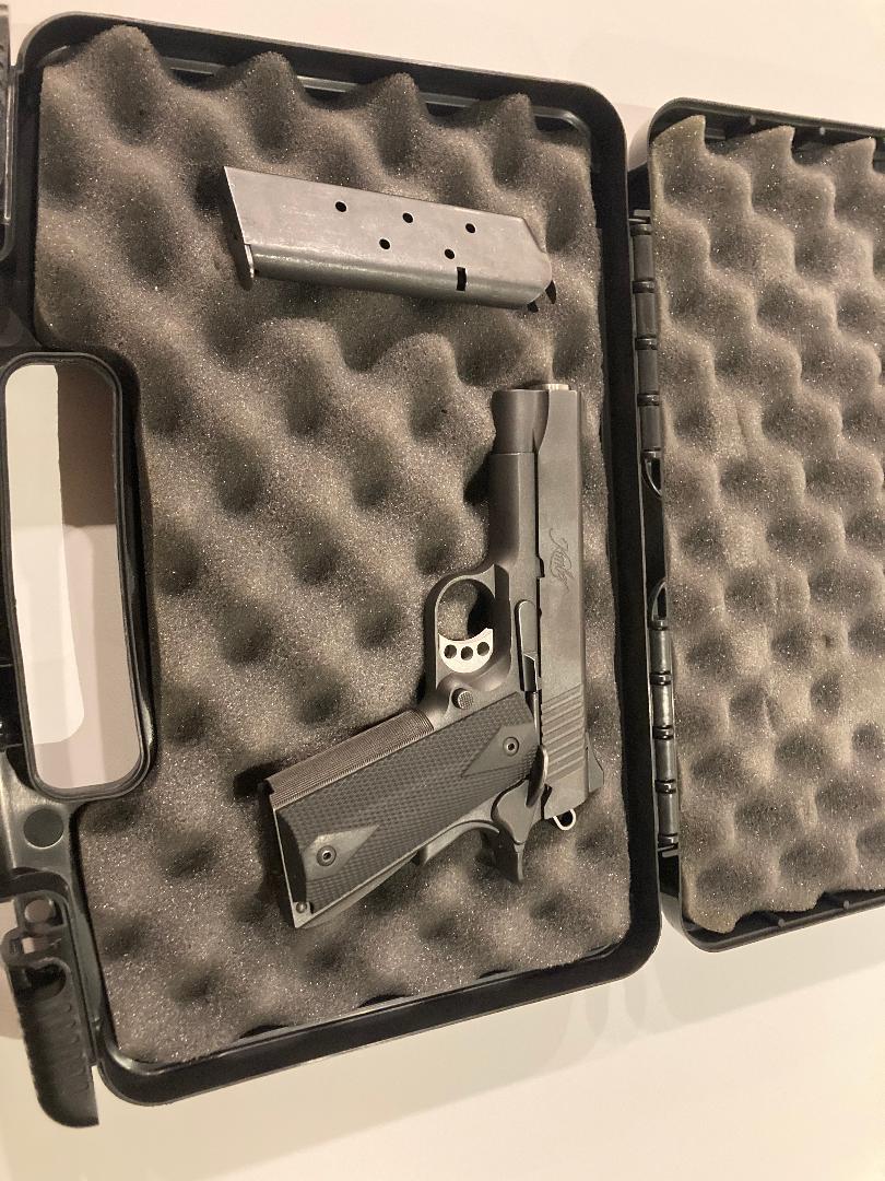 Kimber 1911 (left).jpg